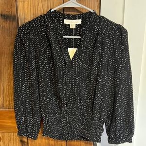 Black and white polkadot blouse